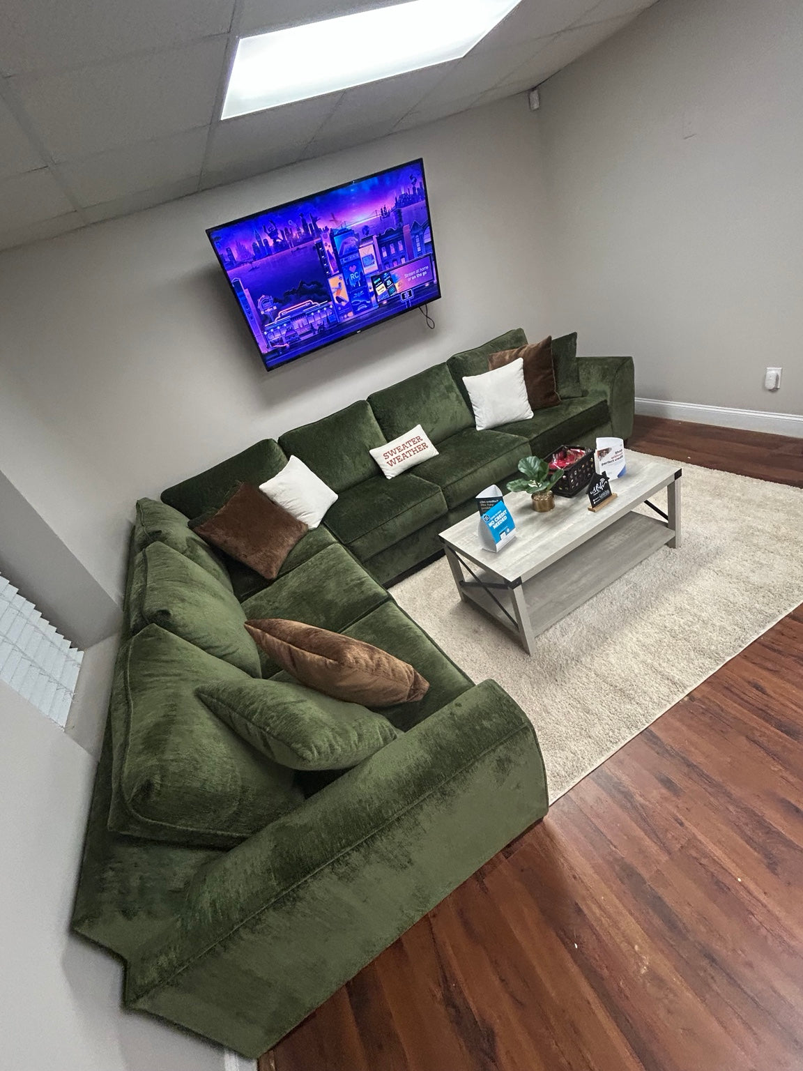 Luscious Green sectional in the Couch King showroom