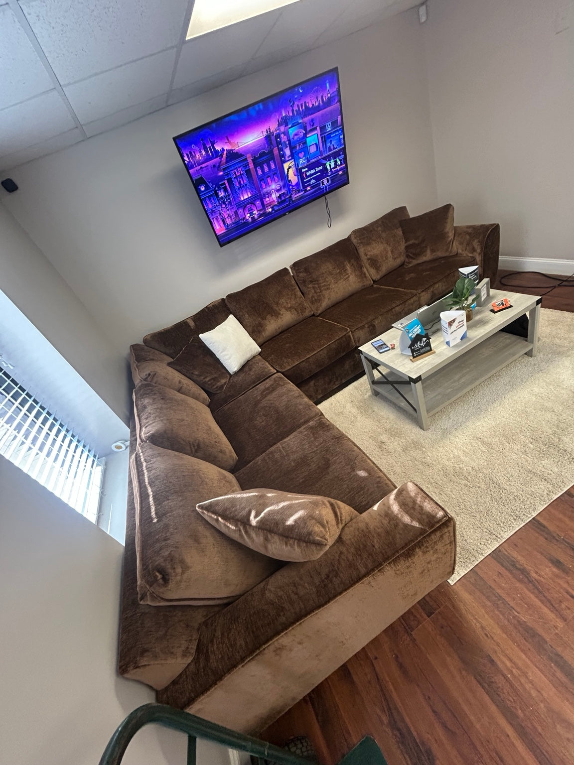 Luxe brown/copper velvet sectional — showroom view 2