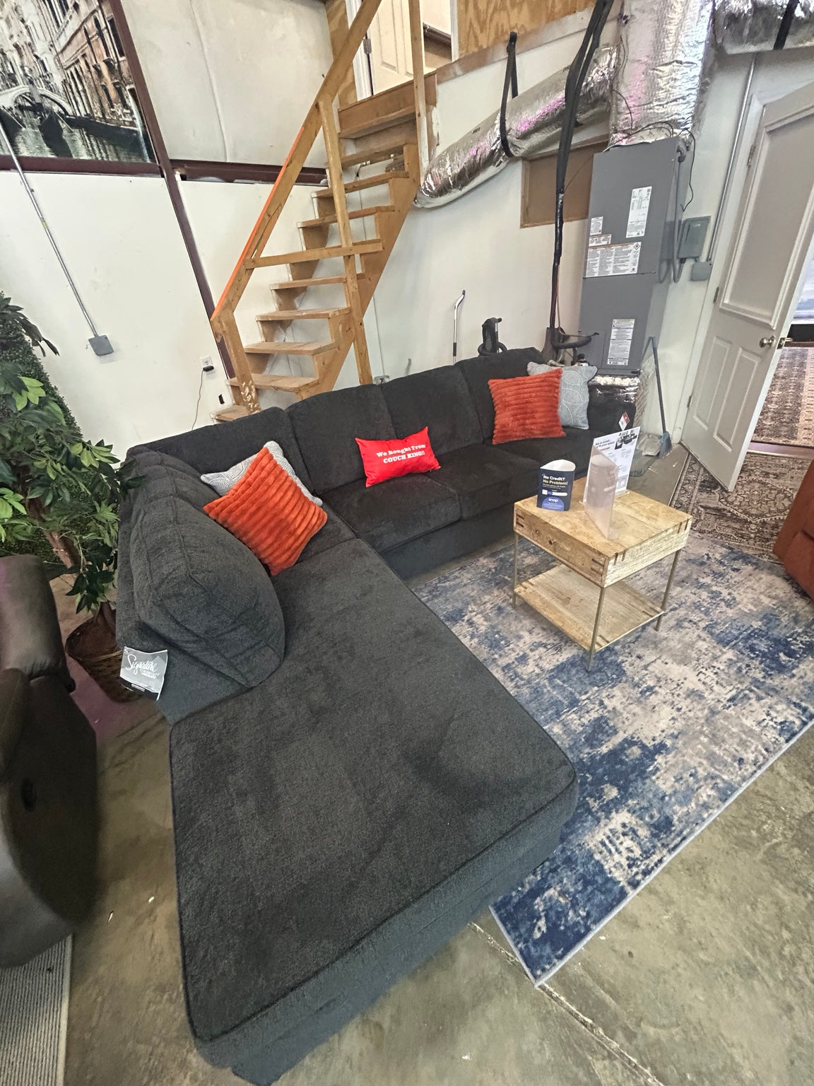 Altari slate left-chaise sectional in the Couch King showroom