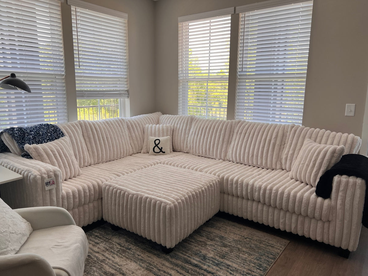 Beige plush corduroy sectional with ottoman