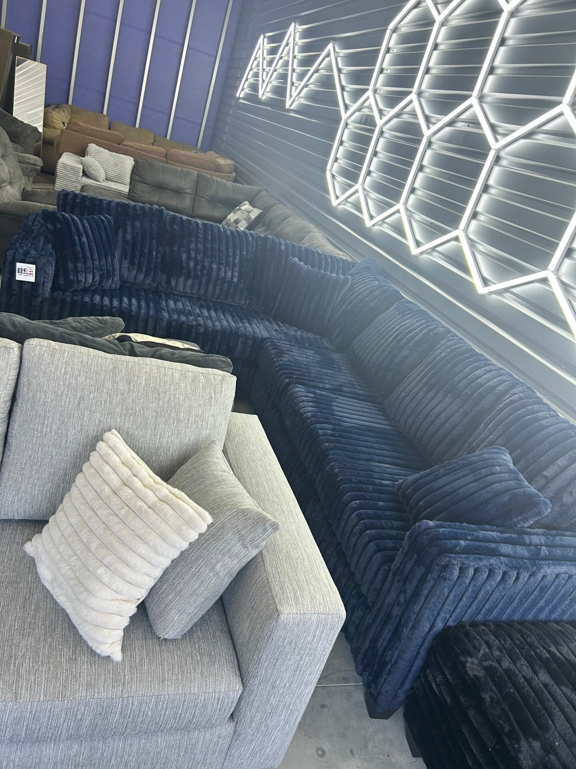 Blue plush corduroy sectional showroom view