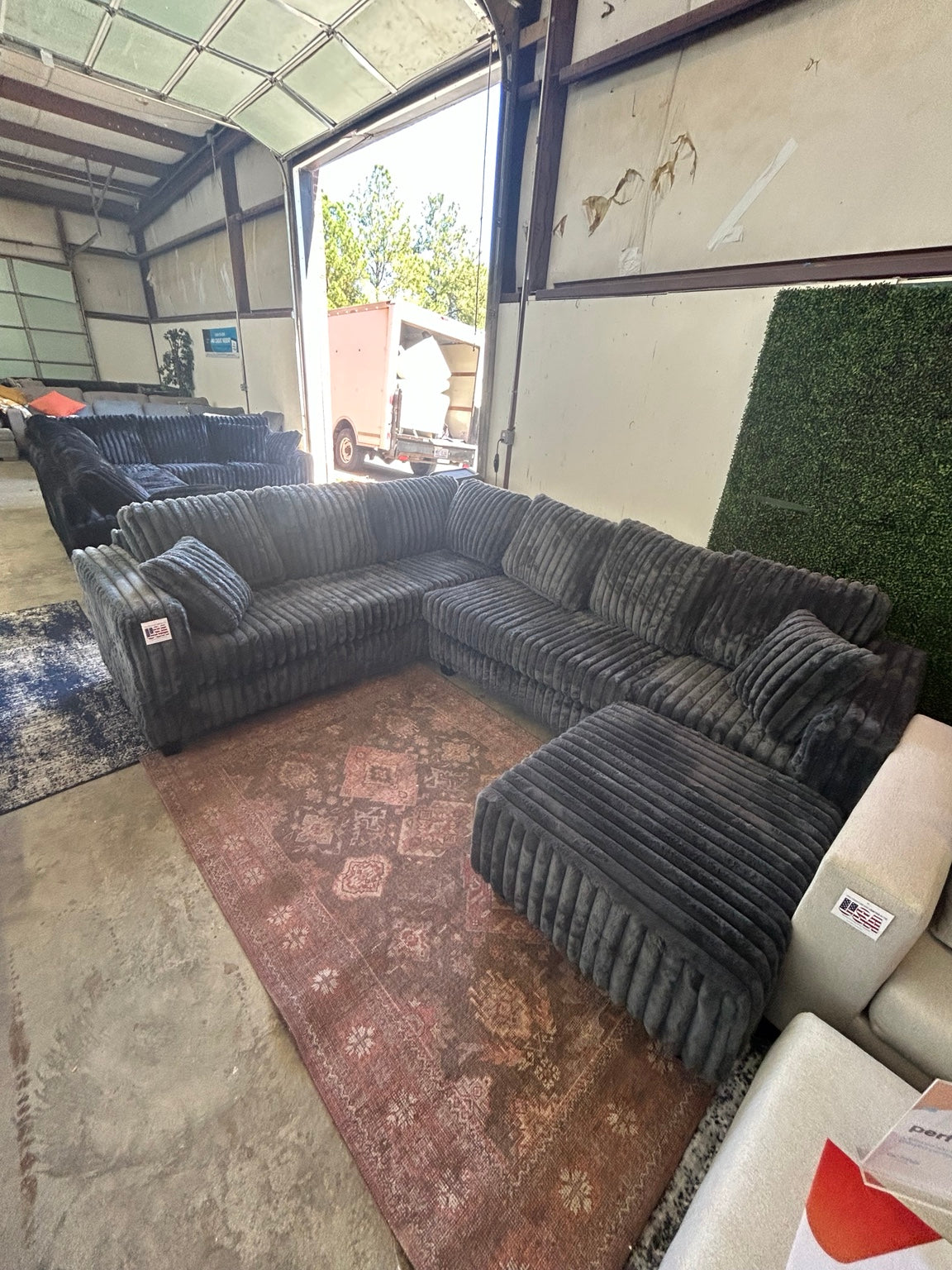 Grey corduroy sectional with matching ottoman
