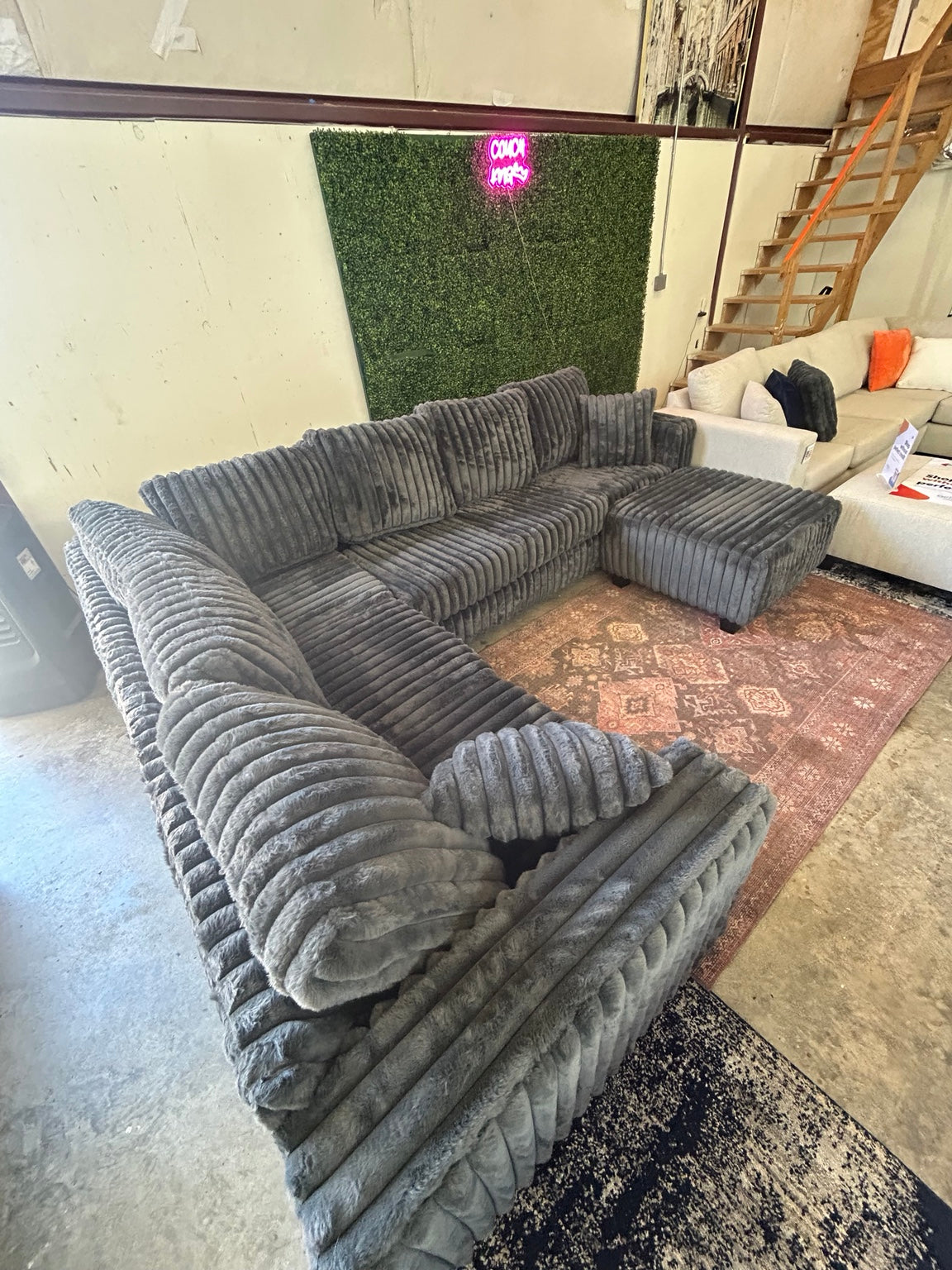 Grey corduroy sectional with matching ottoman