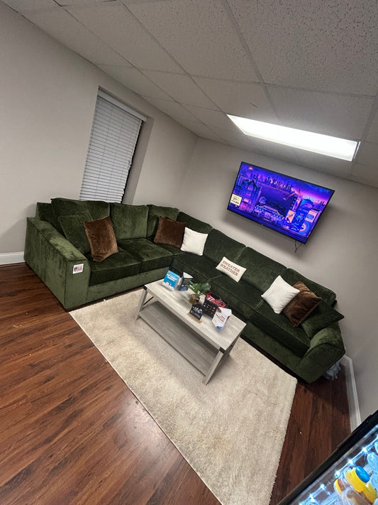 Luscious Green sectional in the Couch King showroom