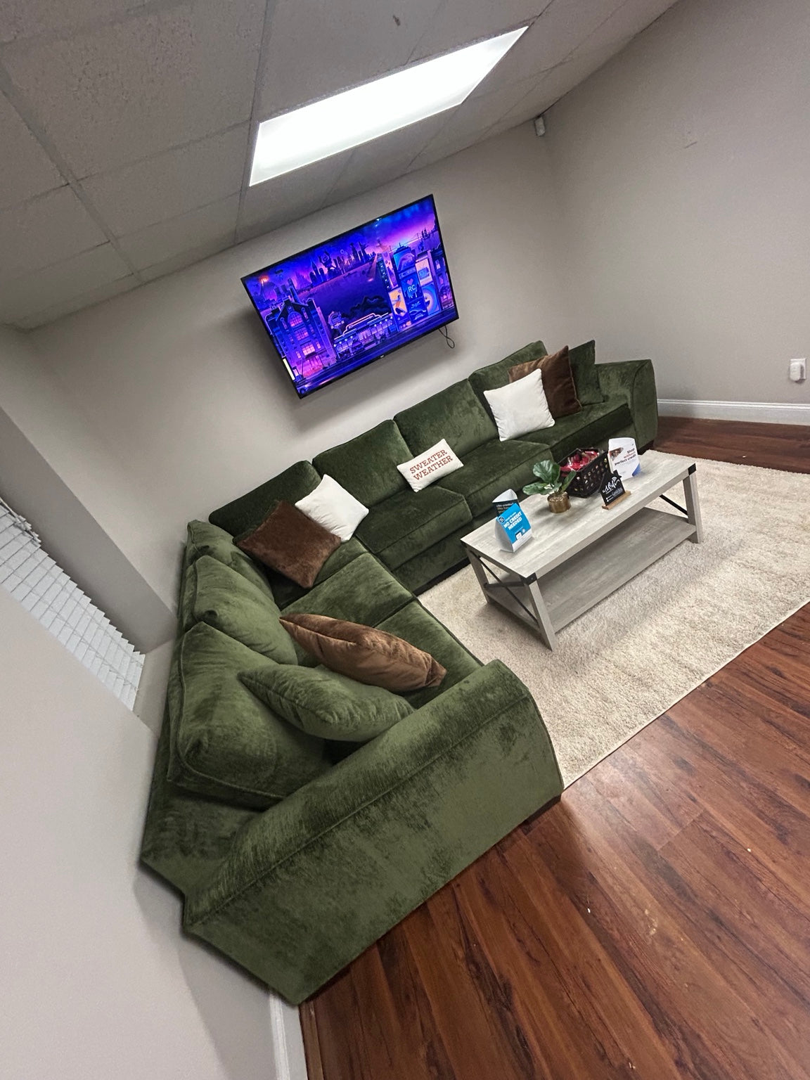 Luscious Green sectional in the Couch King showroom