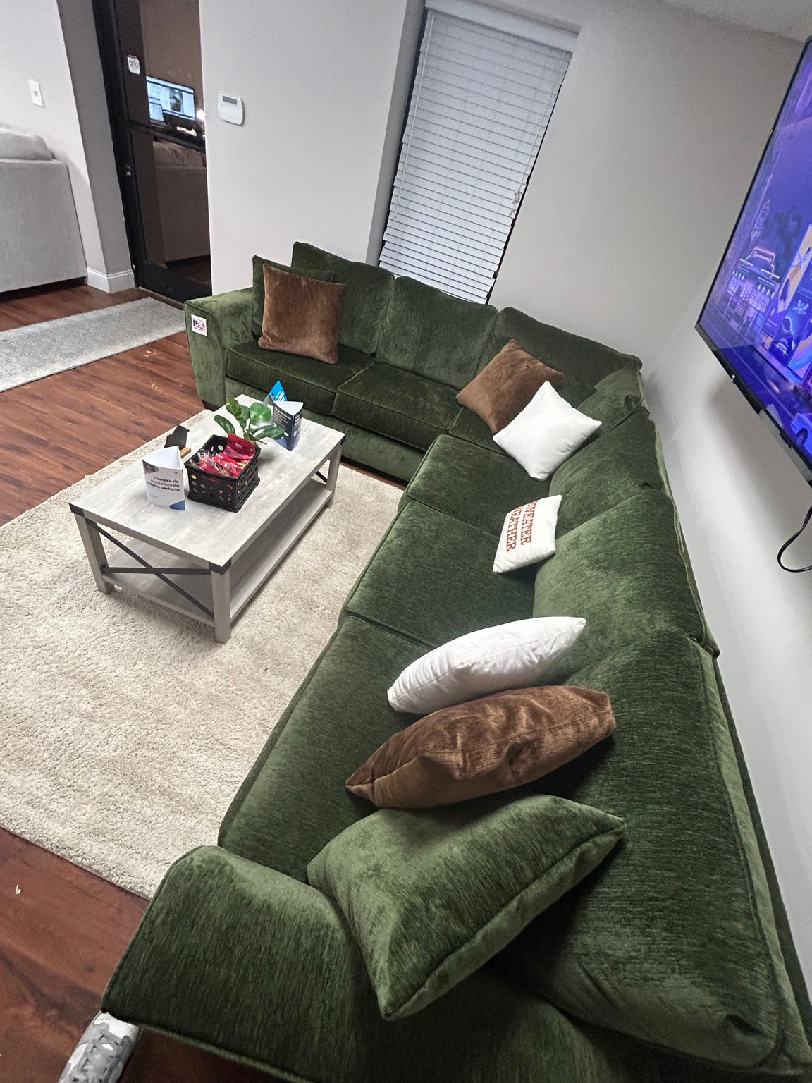Luscious Green sectional in the Couch King showroom