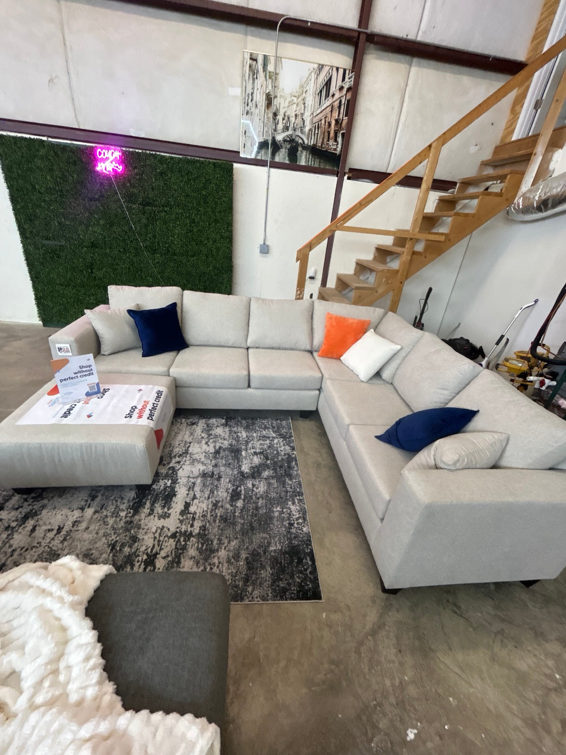Brand-new light grey L-shaped sectional with matching ottoman