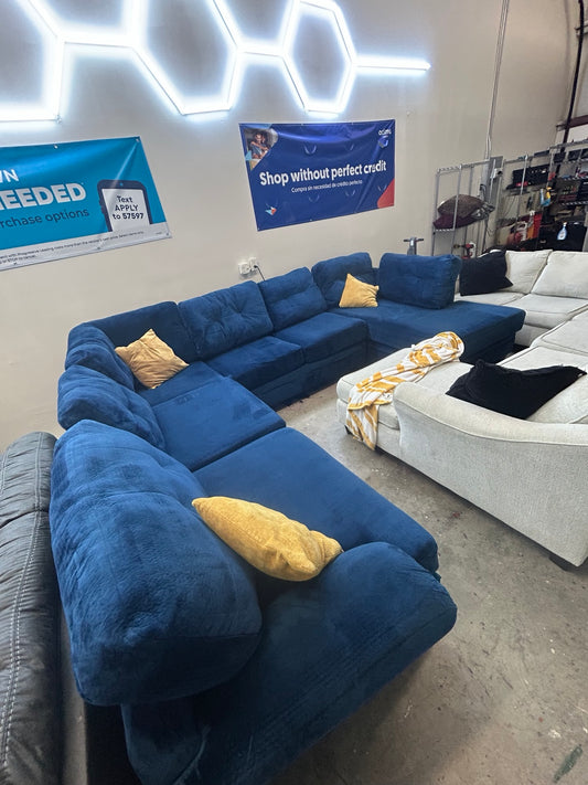Used blue oversized U-shaped sectional