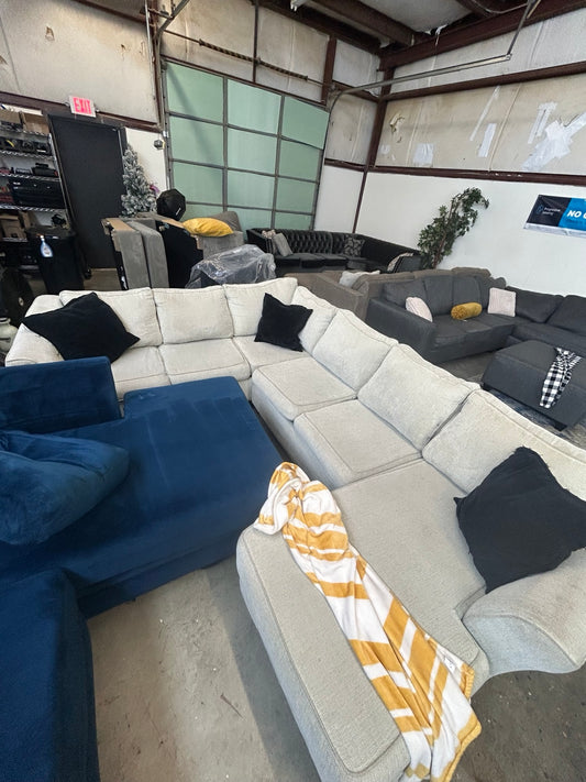 Used cream U-shaped sectional with chaise
