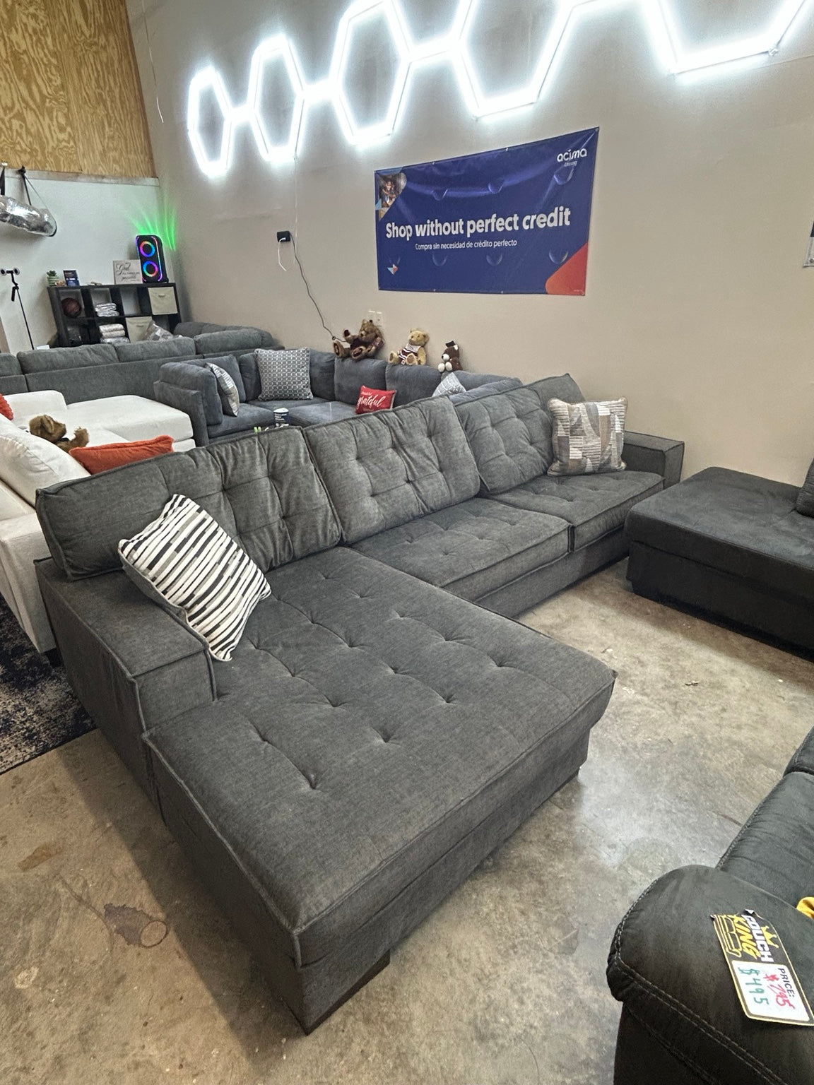 Used grey tufted sectional with chaise — 120 × 75 inches