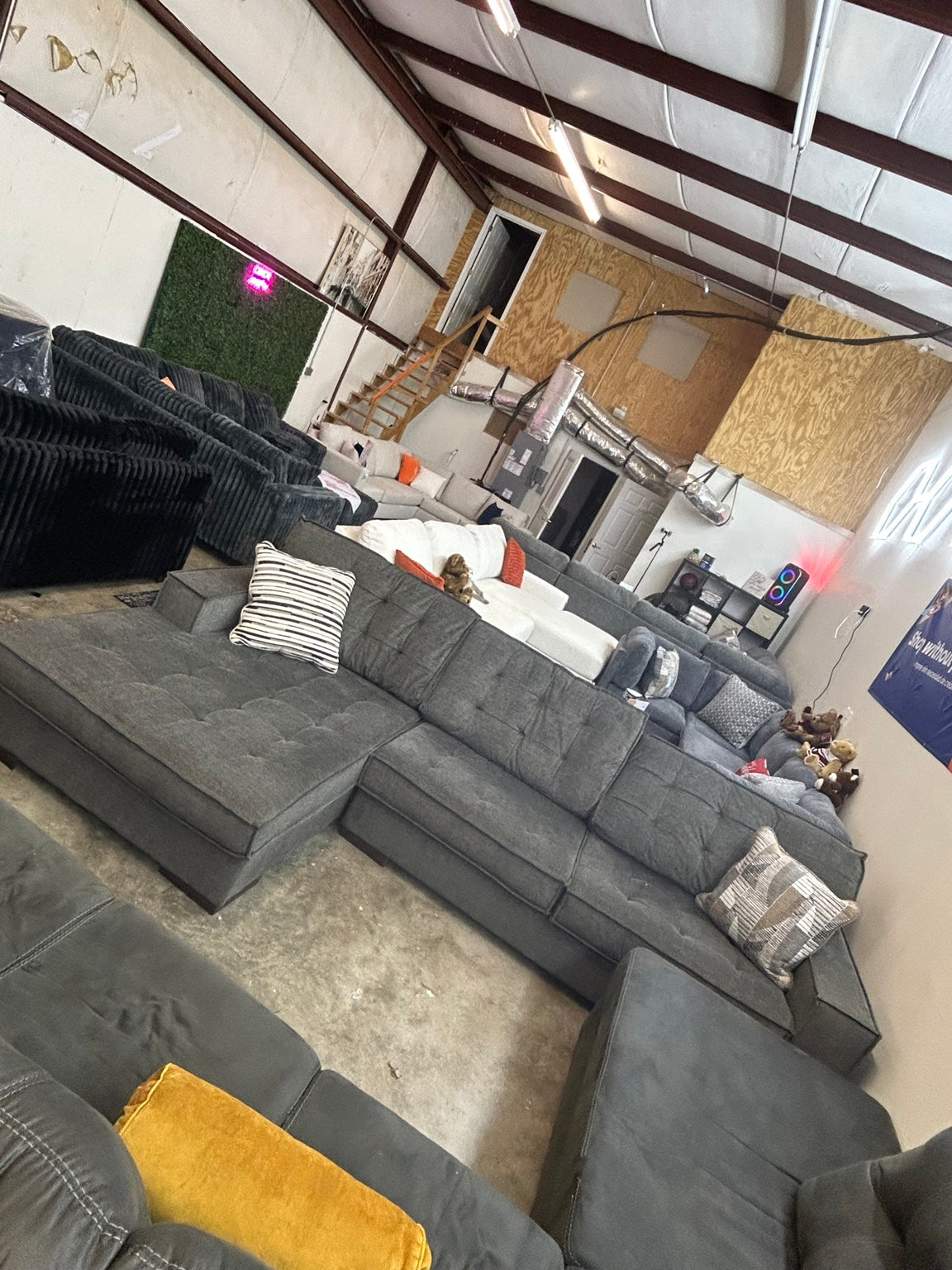 Used grey tufted sectional with chaise — 120 × 75 inches