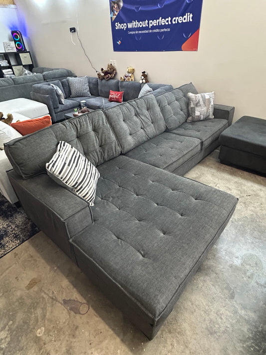 Used grey tufted sectional with chaise — 120 × 75 inches