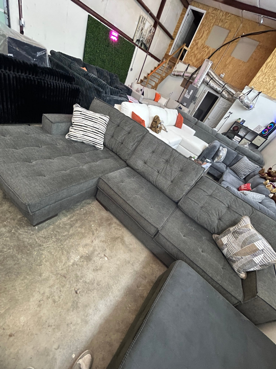 Used grey tufted sectional with chaise — 120 × 75 inches