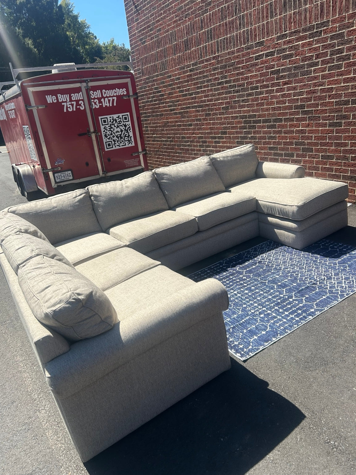 Used light grey U-shaped sectional with chaise