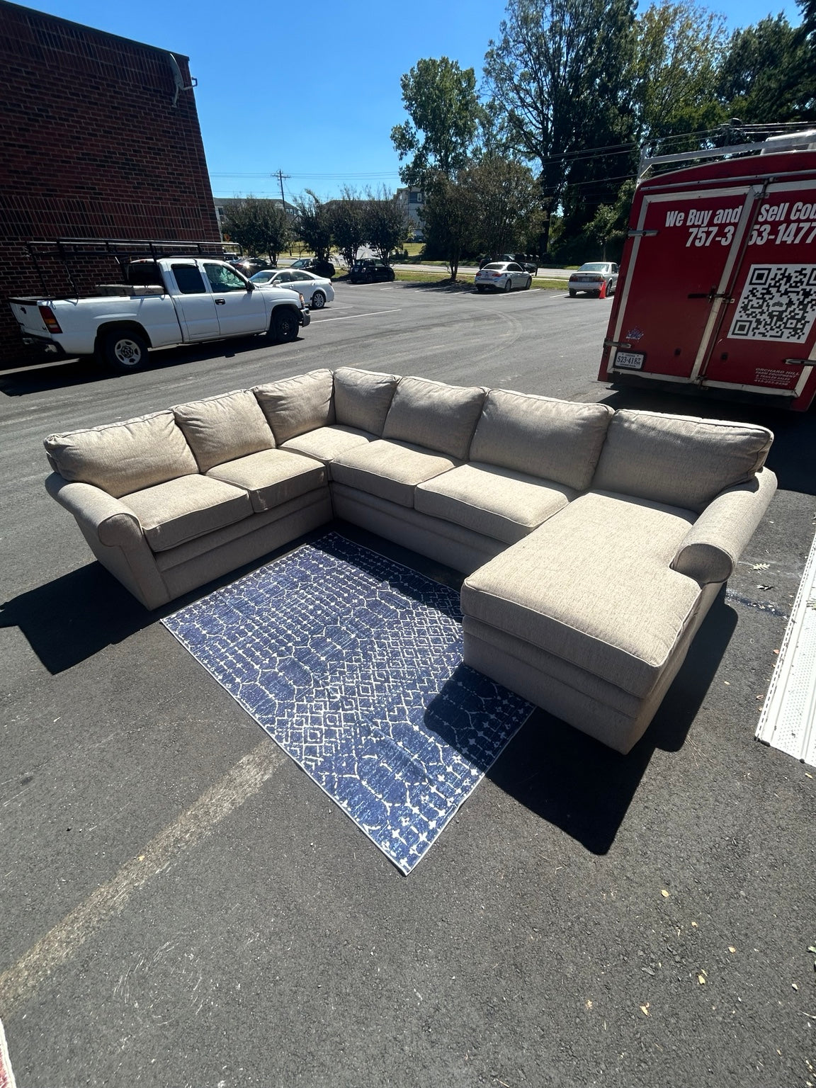 Used light grey U-shaped sectional with chaise