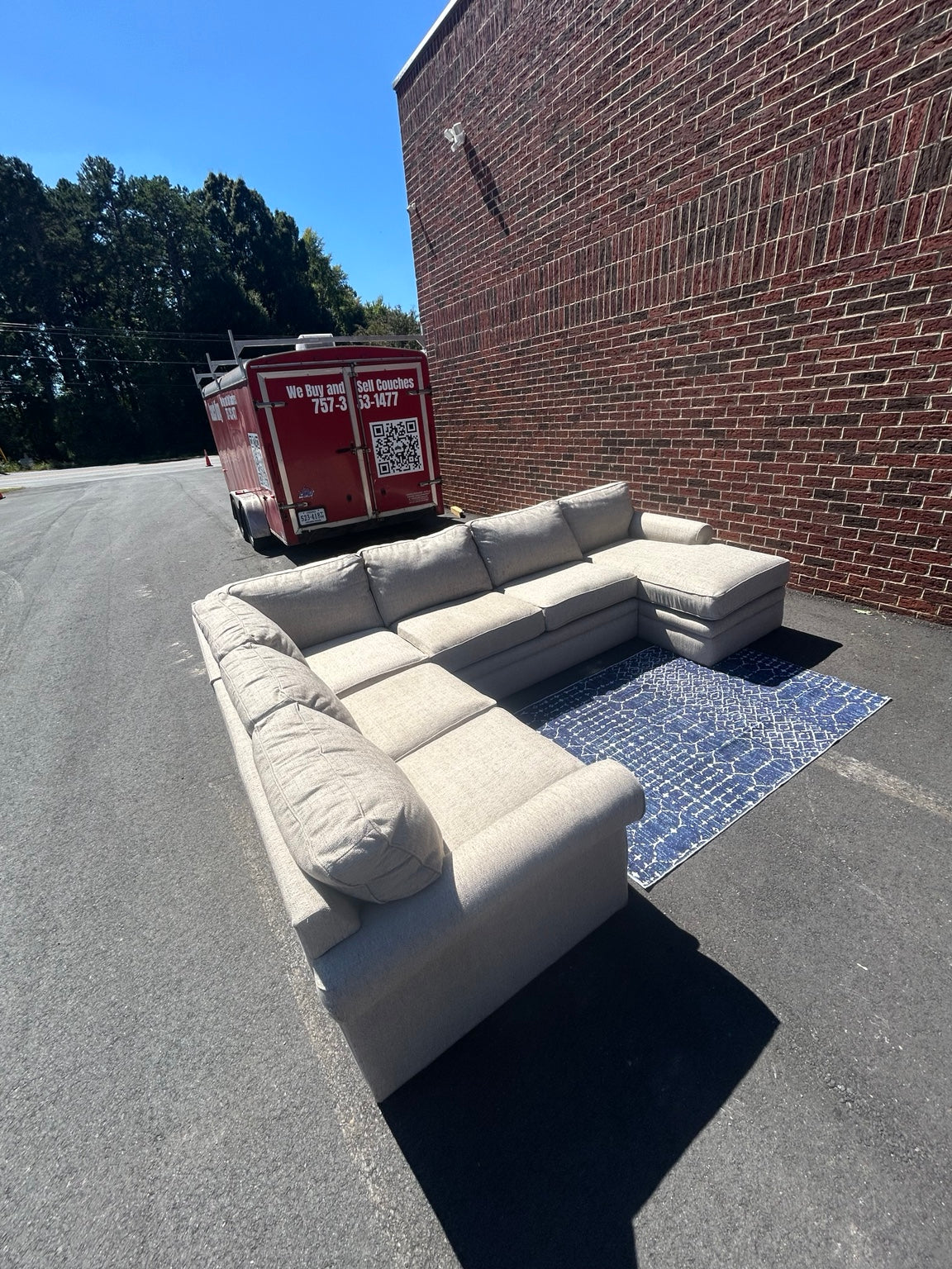 Used light grey U-shaped sectional with chaise