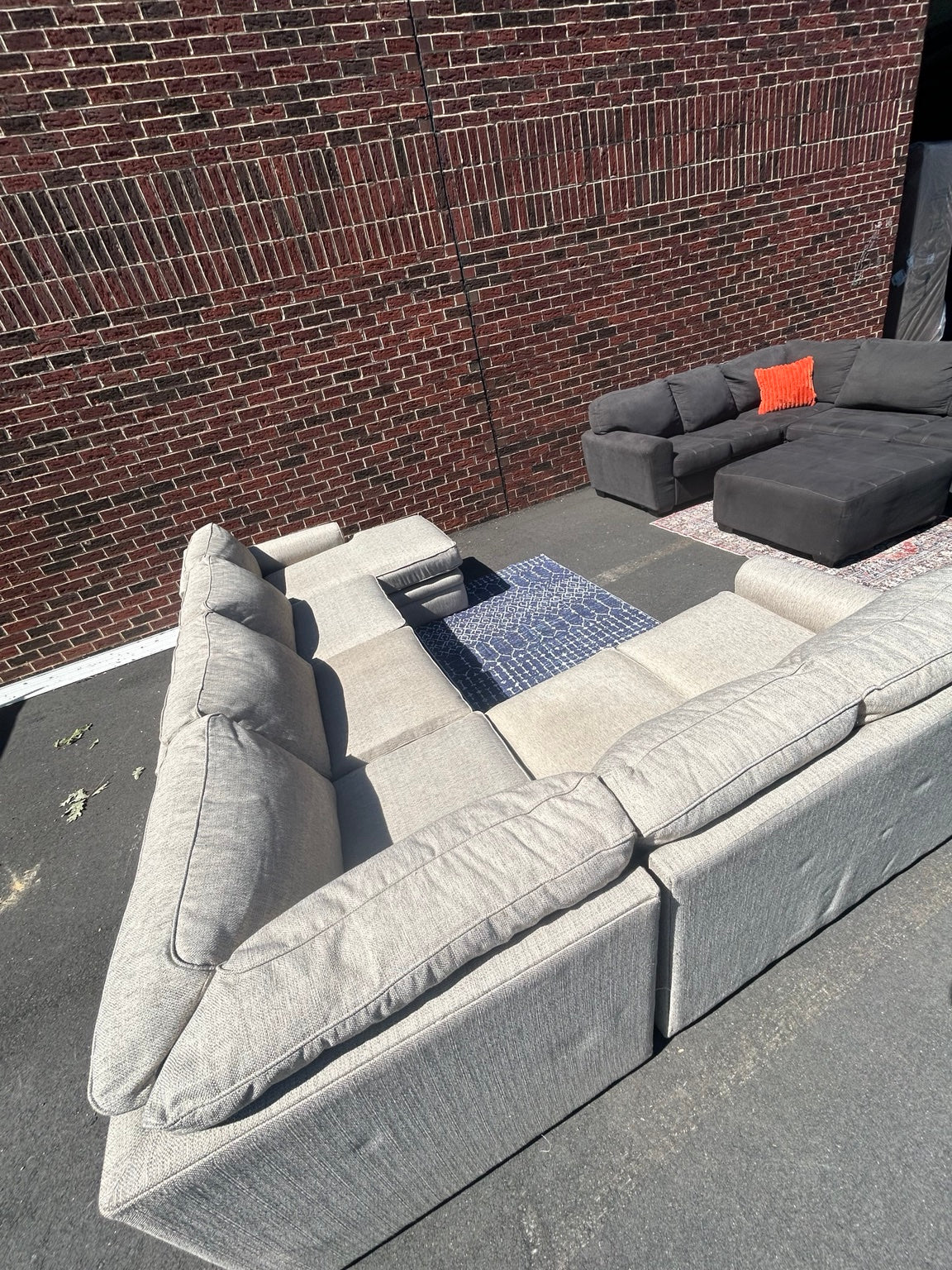 Used light grey U-shaped sectional with chaise